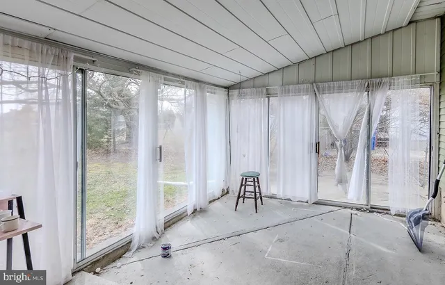 a view of a room with a couch and a table chair