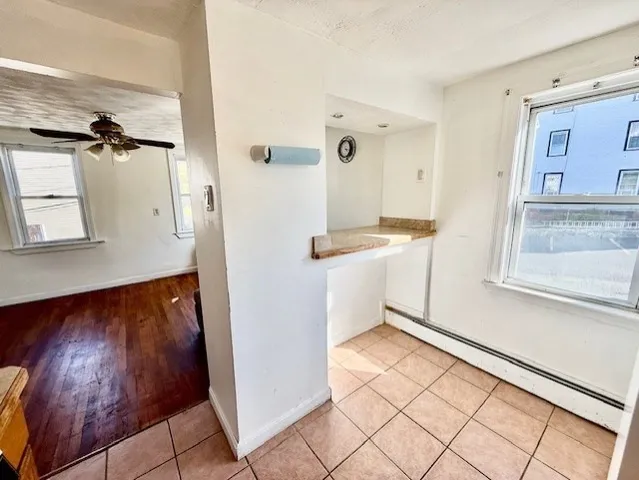 a view of kitchen with furniture and wooden floor