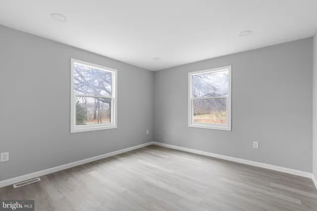 an empty room with windows