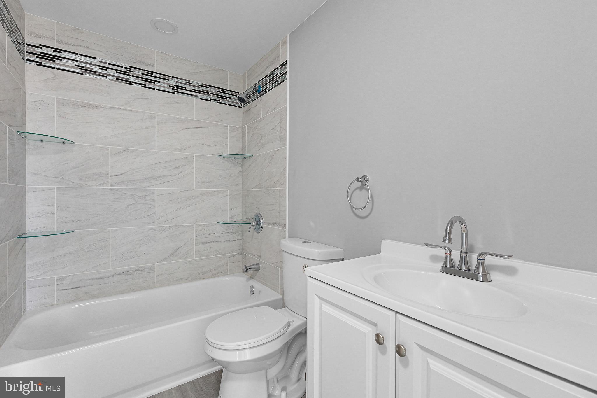 136 State Line Road Wilmington, DE 19803 - Photo 17 of 23 a bathroom with a sink toilet and shower