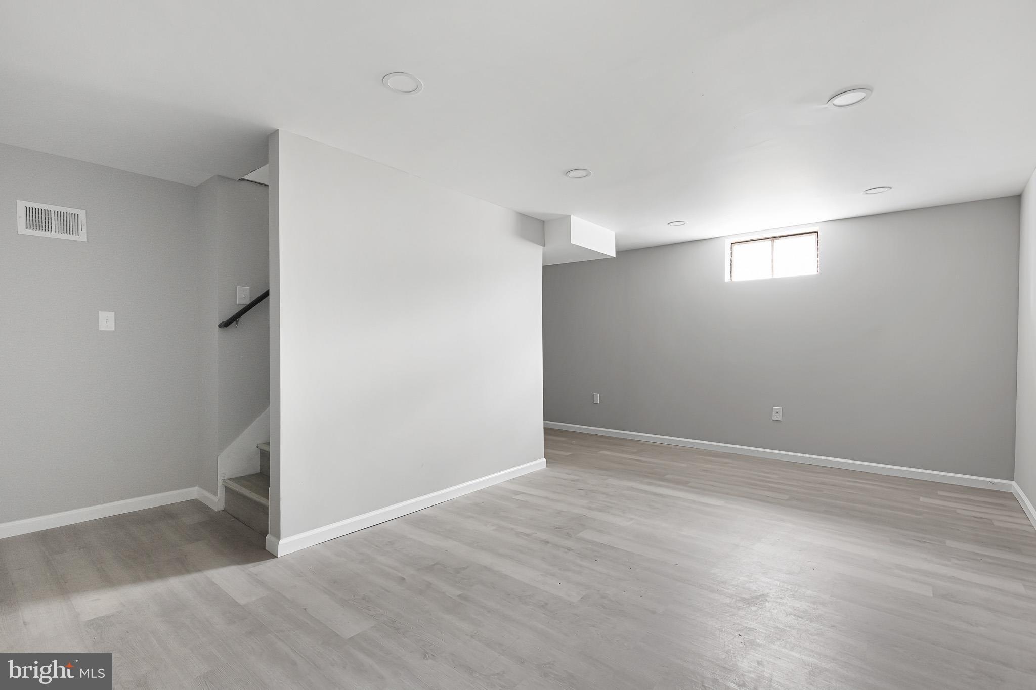 136 State Line Road Wilmington, DE 19803 - Photo 21 of 23 a view of an empty room with wooden floor and a window