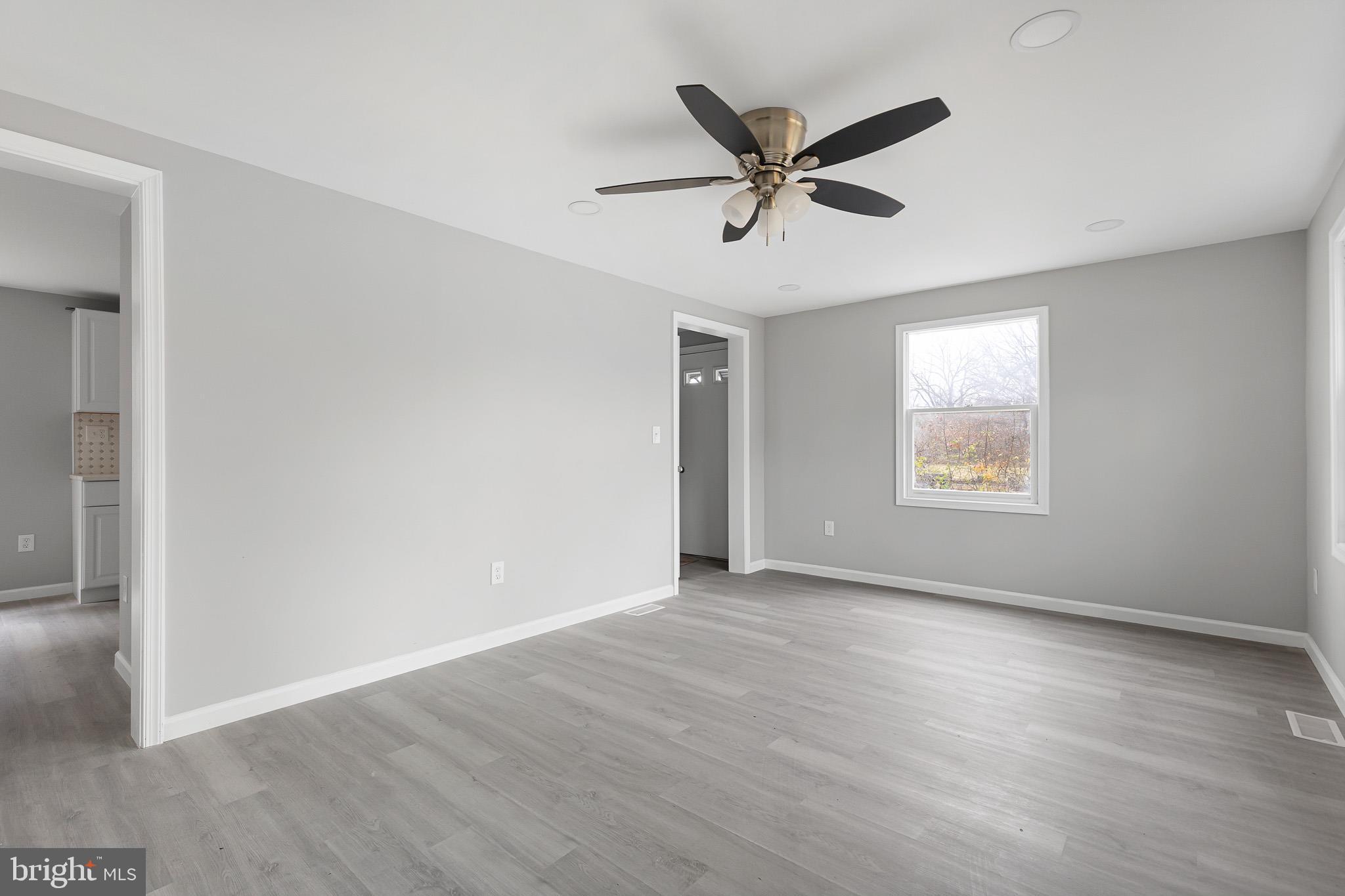136 State Line Road Wilmington, DE 19803 - Photo 3 of 23 a view of a big room with wooden floor and windows