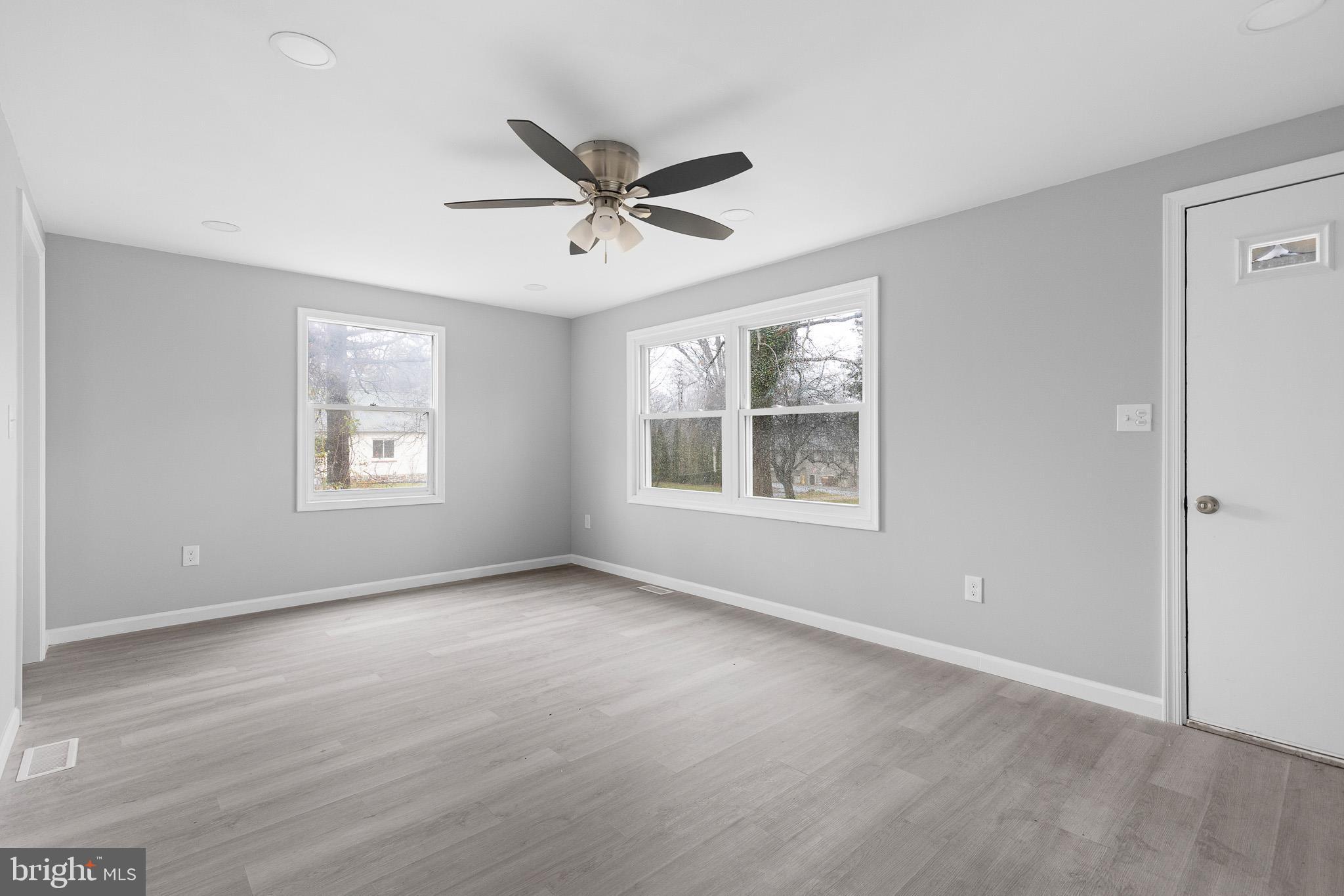 136 State Line Road Wilmington, DE 19803 - Photo 5 of 23 a view of an empty room with a window and wooden floor