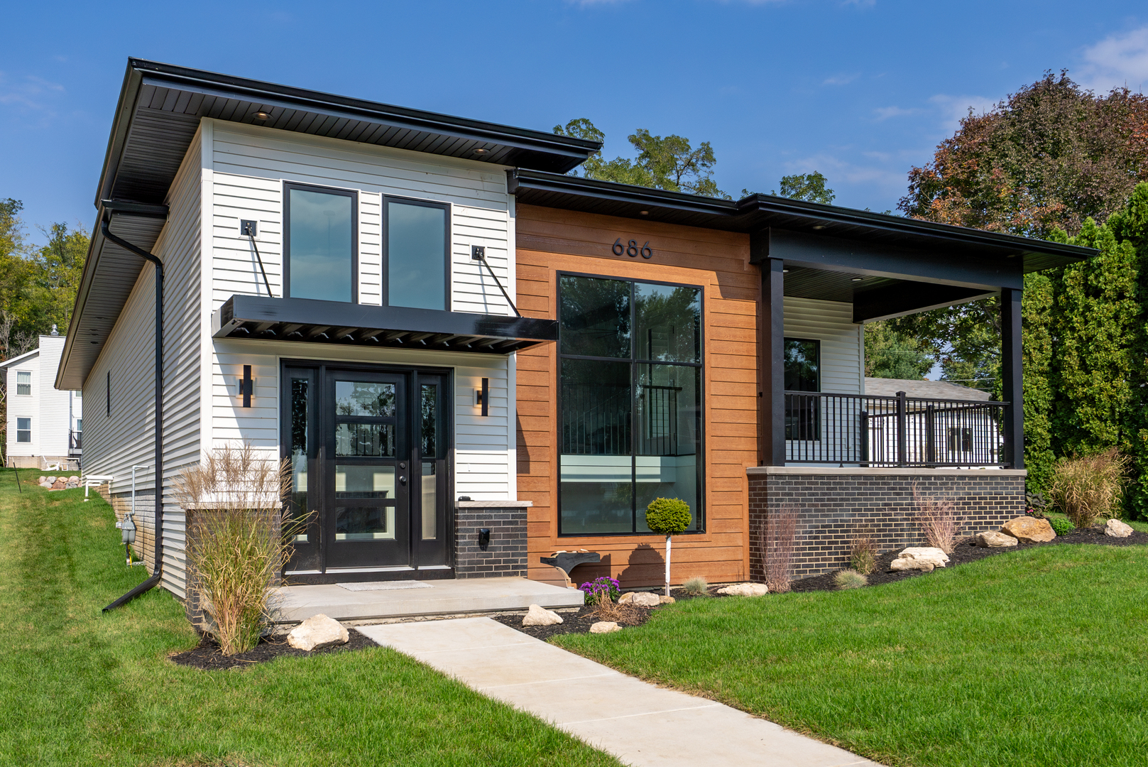 front view of a house with a yard