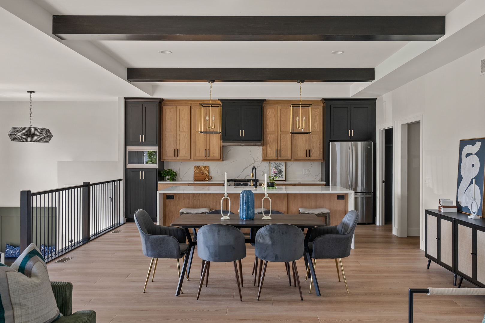 686 Jones Street Bettendorf, IA 52722 - Photo 12 of 21 a view of dining room kitchen with stainless steel appliances kitchen island granite countertop a table chairs and a refrigerator