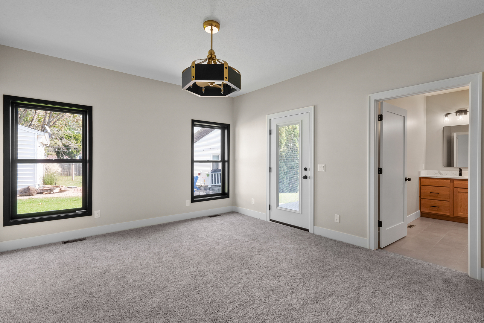 686 Jones Street Bettendorf, IA 52722 - Photo 16 of 21 a view of an empty room with a window and a kitchen