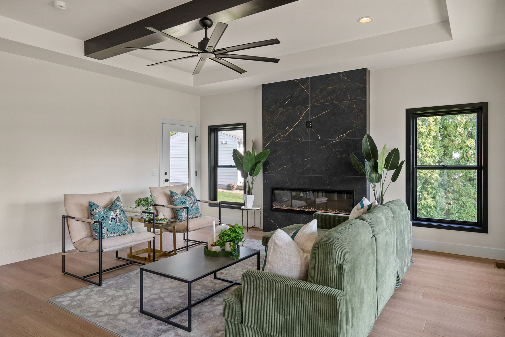 686 Jones Street Bettendorf, IA 52722 - Photo 7 of 21 a living room with furniture a window and a flat screen tv
