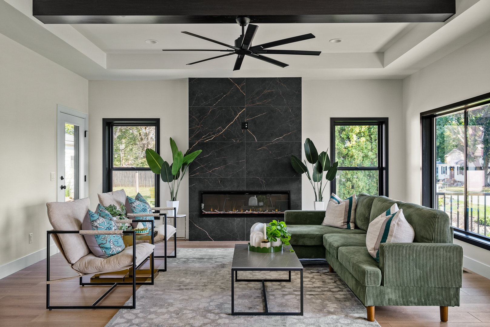 686 Jones Street Bettendorf, IA 52722 - Photo 8 of 21 a living room with furniture a large window and a fireplace