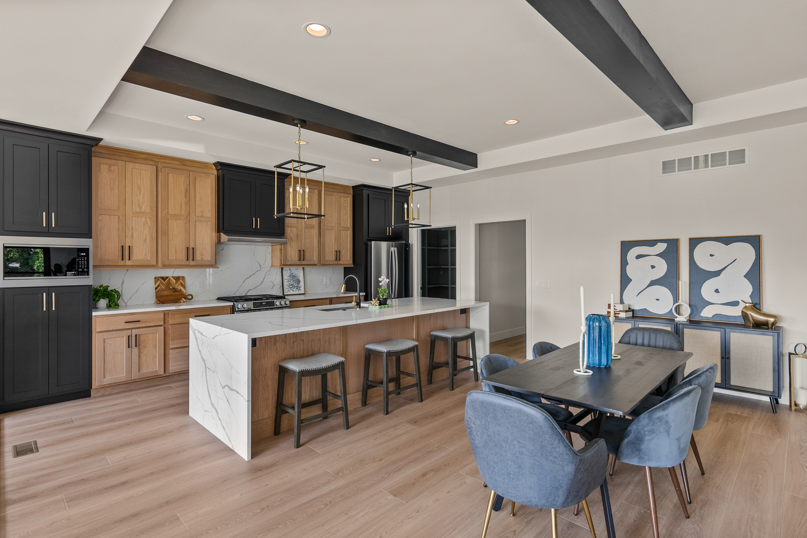 686 Jones Street Bettendorf, IA 52722 - Photo 10 of 21 a kitchen with a stove a table and chairs in it
