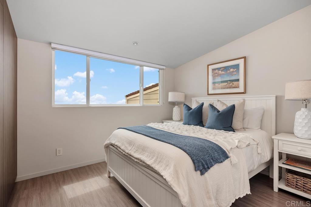 1856 Parliament Road Encinitas, CA 92024 - Photo 27 of 42 a bedroom with bed and a window