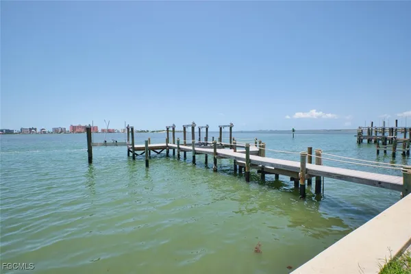 a view of a lake and outdoor seating