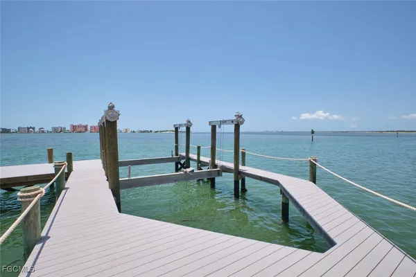 a view of a wooden deck with a yard