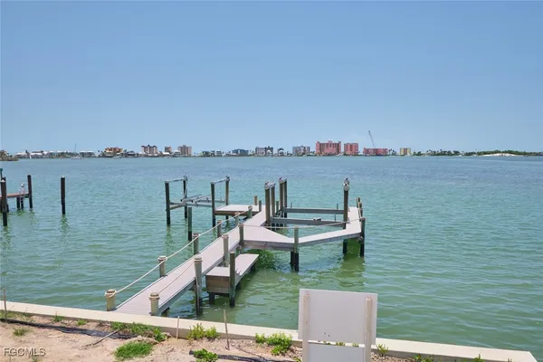 a view of a lake with outdoor seating