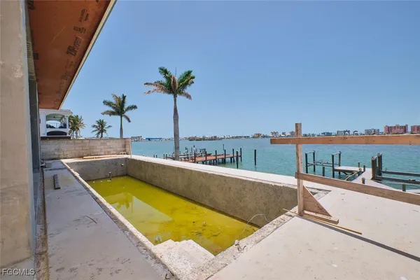 a view of a swimming pool with a lounge chair
