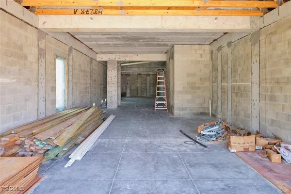 a view of a patio with table and chairs