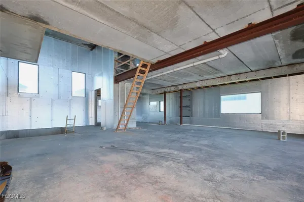 a view of an empty room with stairs