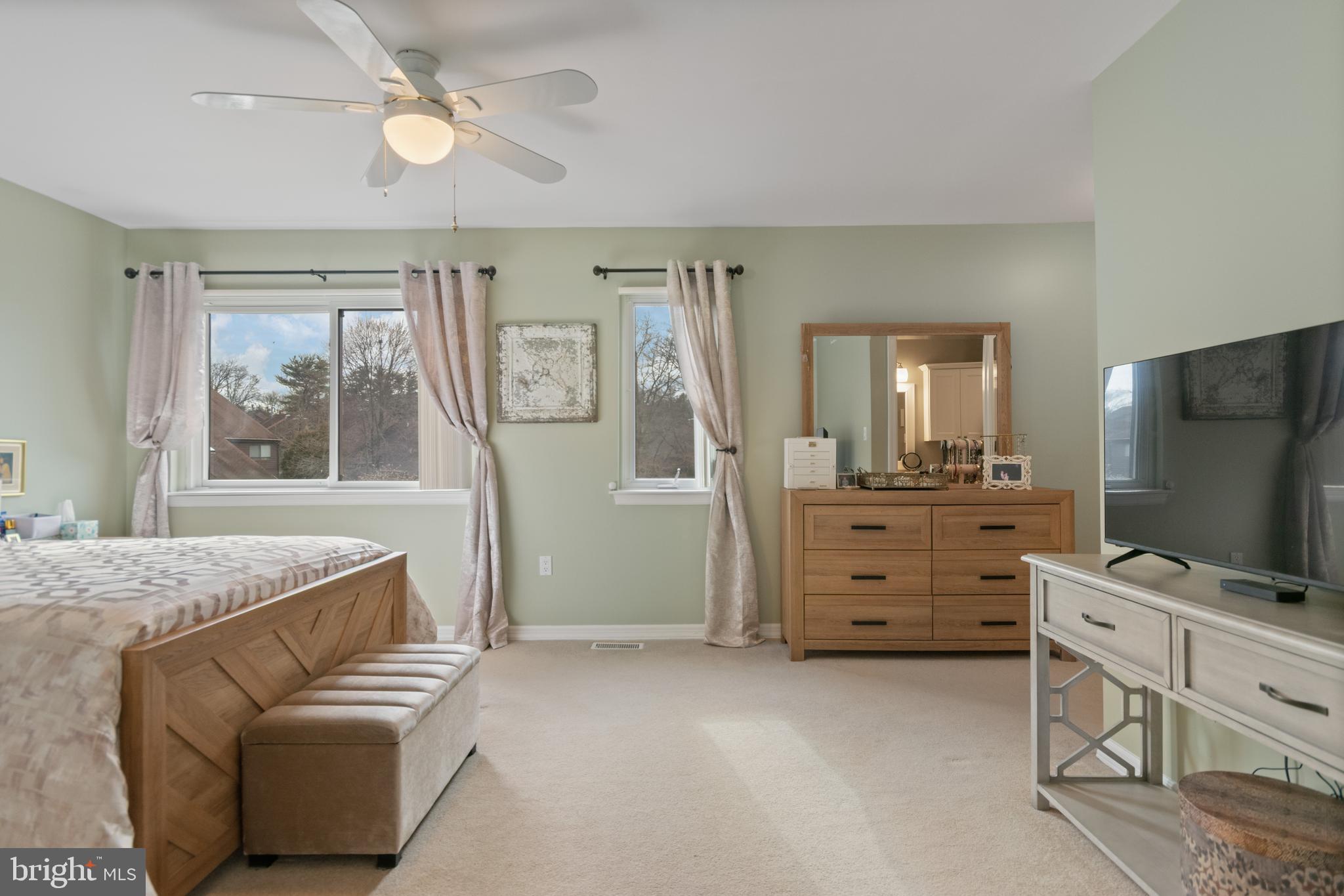 24 Jacob Court Ewing, NJ 08628 - Photo 11 of 14 a living room with furniture and a flat screen tv