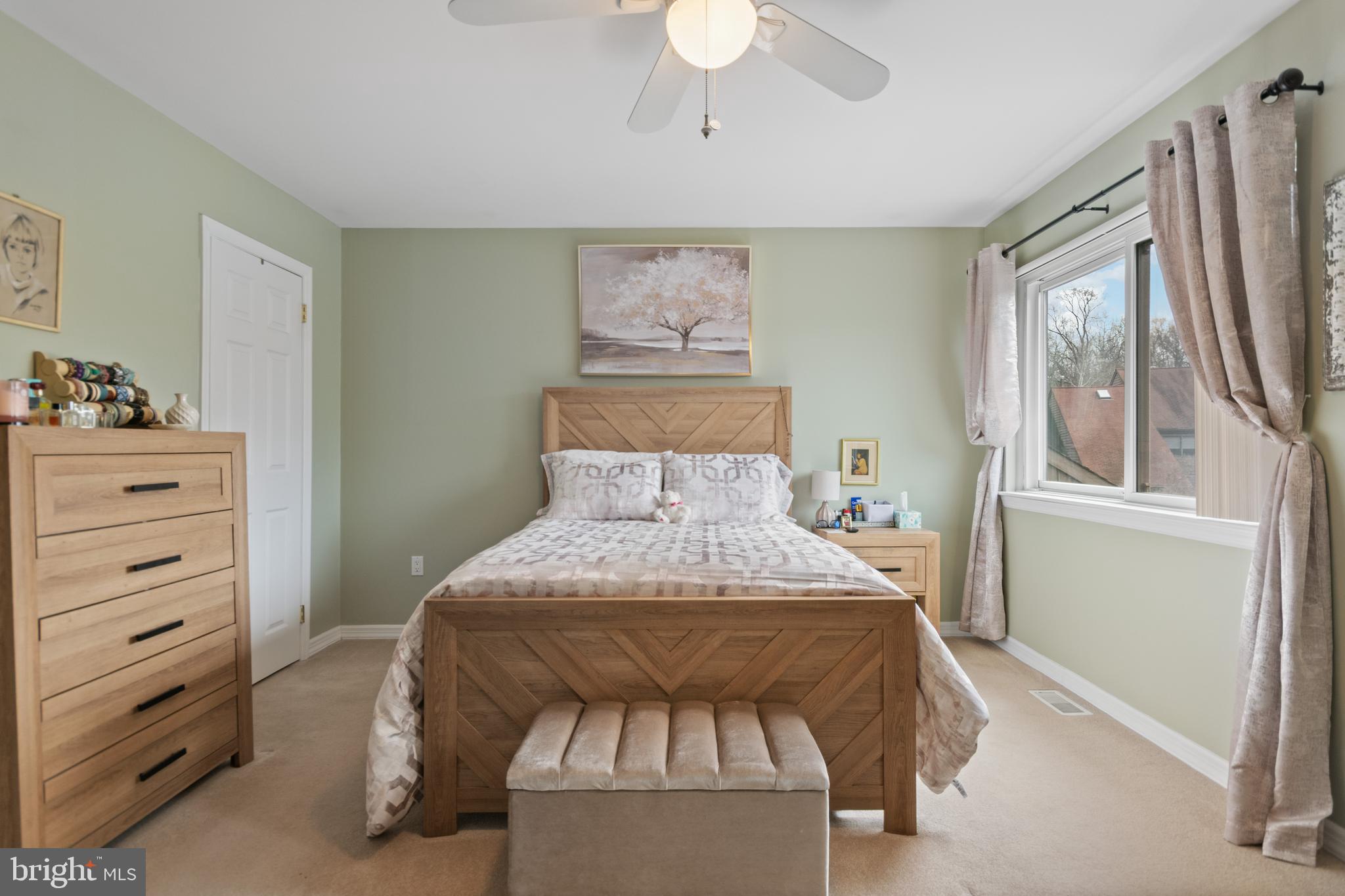 24 Jacob Court Ewing, NJ 08628 - Photo 12 of 14 a bedroom with a bed and a chandelier