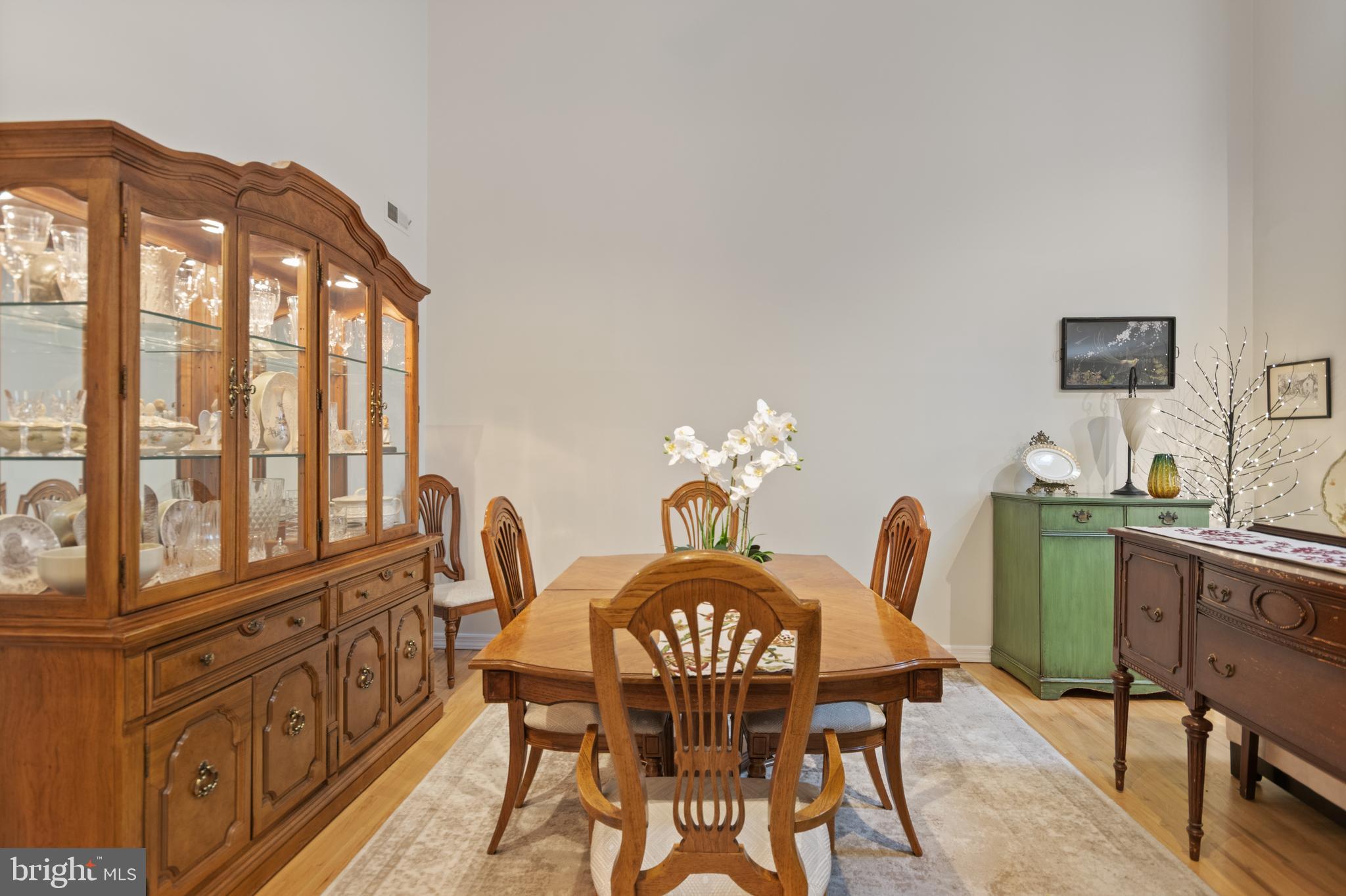 24 Jacob Court Ewing, NJ 08628 - Photo 5 of 14 a dining room with furniture a window and a chandelier