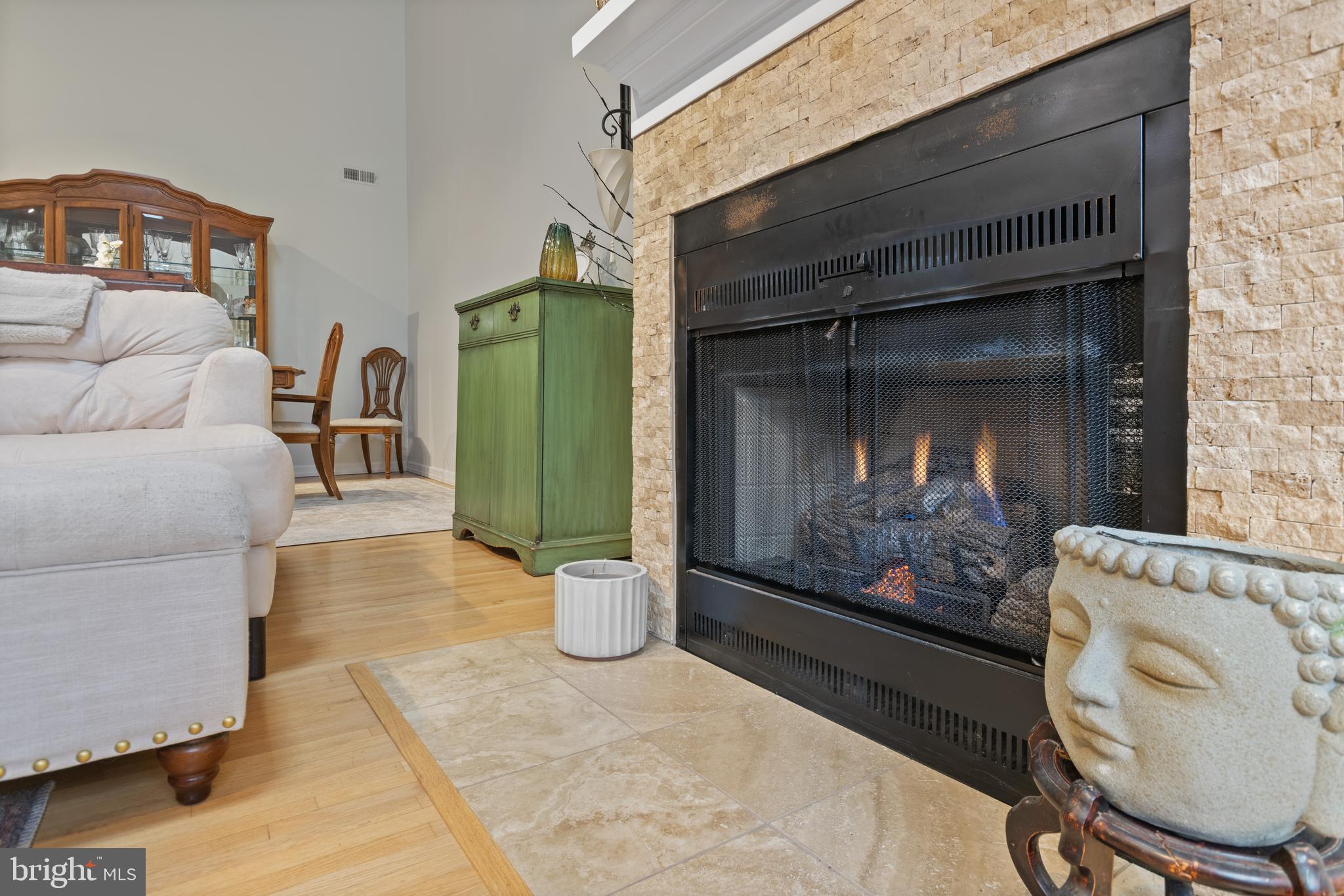 24 Jacob Court Ewing, NJ 08628 - Photo 8 of 14 a living room with furniture and a fireplace
