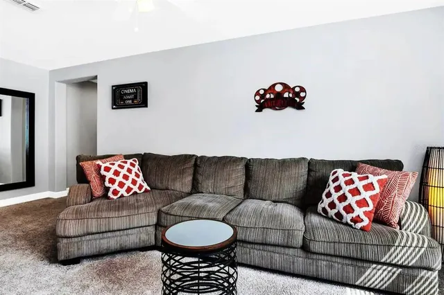 a living room with furniture and a couch