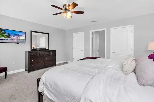 a bedroom with a bed and a dresser