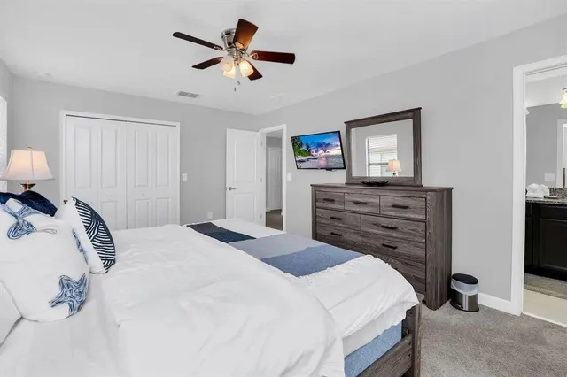 a bed room with a bed and a television