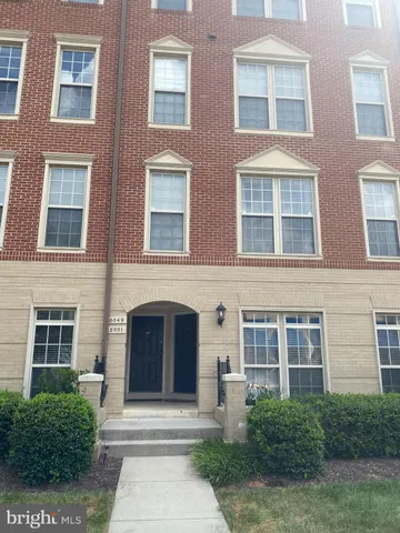 a front view of a brick building with windows