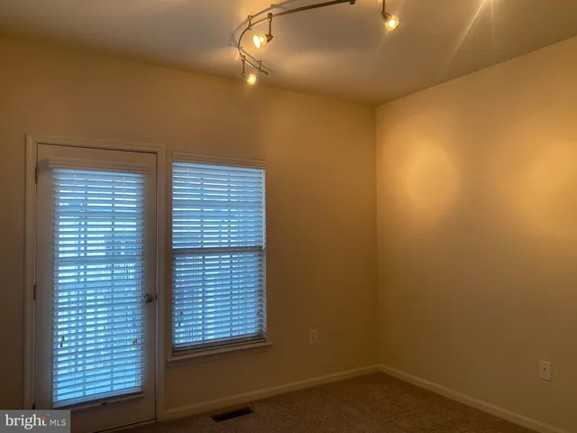 a view of empty room with windows