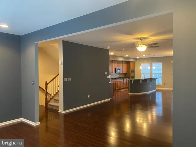 a view of a living room with hardwood floor