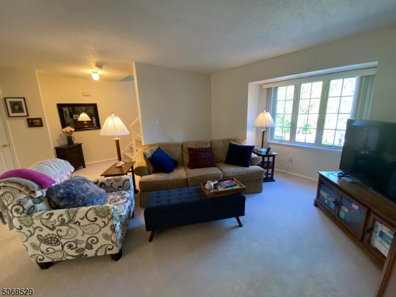 15 Starling Way Berkeley Heights, NJ 07922 - Photo 11 of 21 a living room with furniture and a flat screen tv
