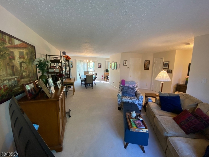 15 Starling Way Berkeley Heights, NJ 07922 - Photo 13 of 21 a living room with furniture and a flat screen tv