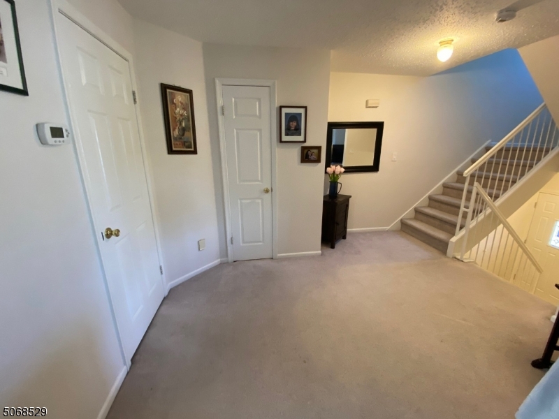 15 Starling Way Berkeley Heights, NJ 07922 - Photo 16 of 21 a view of a livingroom with wooden floor and stairs