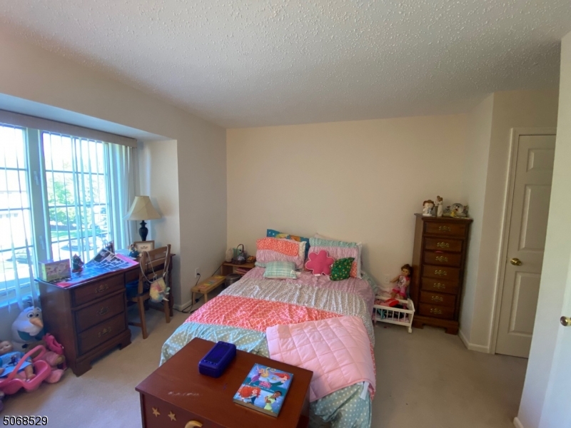 15 Starling Way Berkeley Heights, NJ 07922 - Photo 19 of 21 a bedroom with a bed and a window