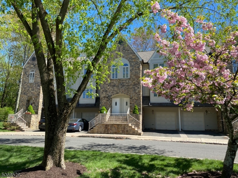 15 Starling Way Berkeley Heights, NJ 07922 - Photo 4 of 21 a front view of a house with a tree