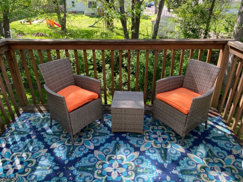 15 Starling Way Berkeley Heights, NJ 07922 - Photo 10 of 21 a view of a patio with chair and wooden floor
