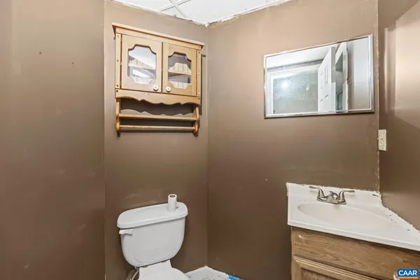 a bathroom with a toilet and a sink
