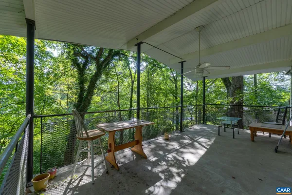 a view of a two chairs in the patio