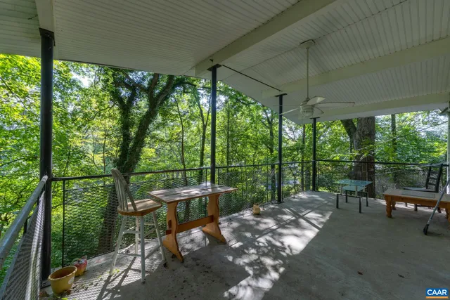 a view of a two chairs in the patio