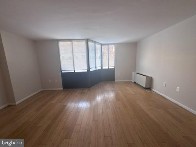 1718 P Street Northwest, Unit L2 Washington, DC 20036 - Photo 1 of 9 an empty room with wooden floor and windows