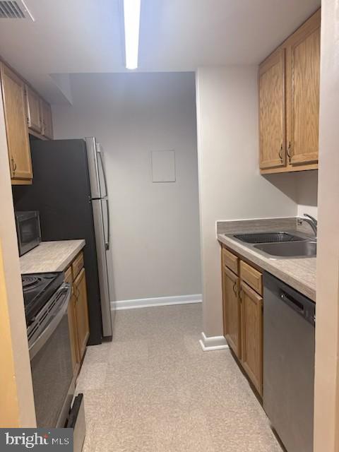 1718 P Street Northwest, Unit L2 Washington, DC 20036 - Photo 3 of 9 a kitchen with stainless steel appliances a stove microwave and refrigerator
