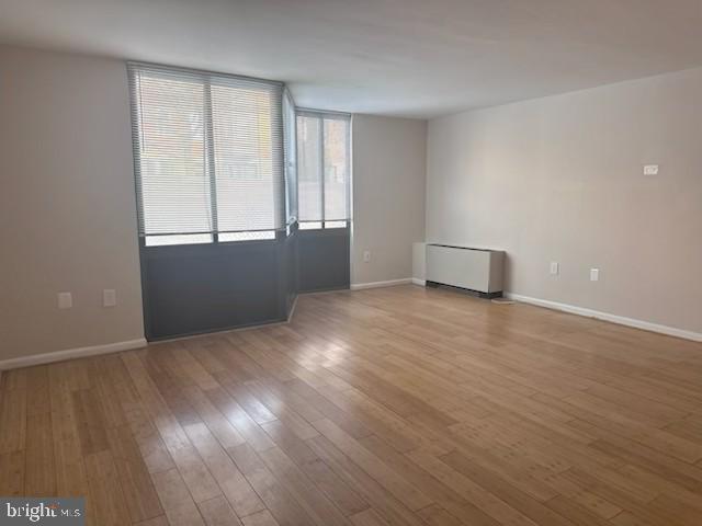 1718 P Street Northwest, Unit L2 Washington, DC 20036 - Photo 7 of 9 a view of an empty room with wooden floor and a window