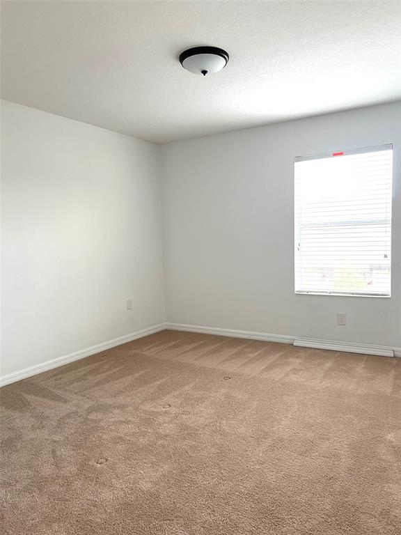 7681 Fordson Lane Windermere, FL 34786 - Photo 13 of 17 an empty room with a window