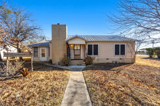 a front view of a house with a patio