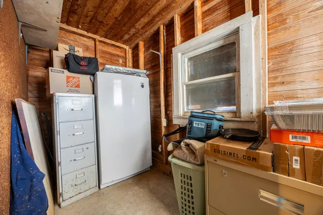 a view of a patio with table and chairs potted plants with wooden floor