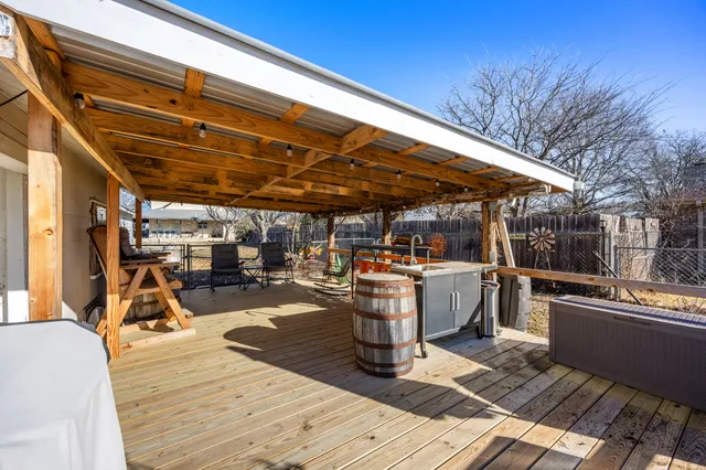 a view of a yard with a large tree