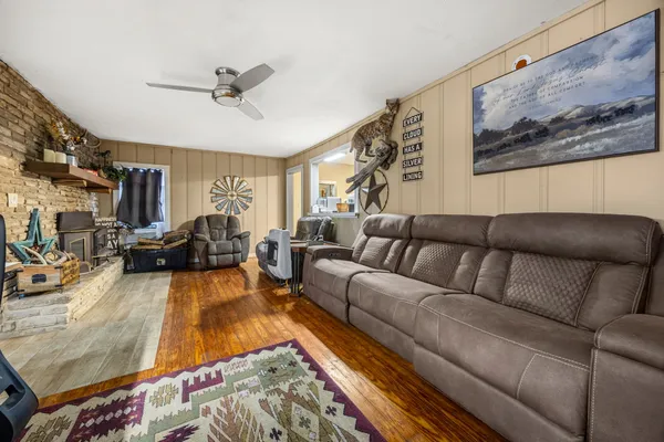 a living room with furniture or couch and a flat screen tv