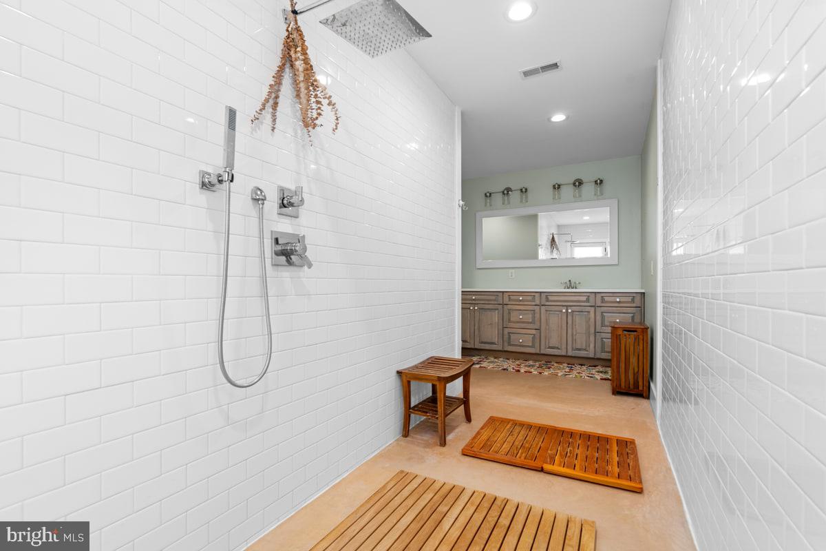 13 Rope Walk Road Upper Black Eddy, PA 18972 - Photo 11 of 40 a bathroom with a sink a toilet and shower