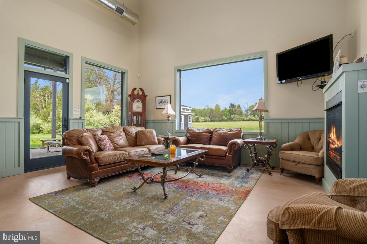 13 Rope Walk Road Upper Black Eddy, PA 18972 - Photo 8 of 40 a living room with furniture and a flat screen tv