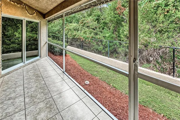 a view of balcony with yard
